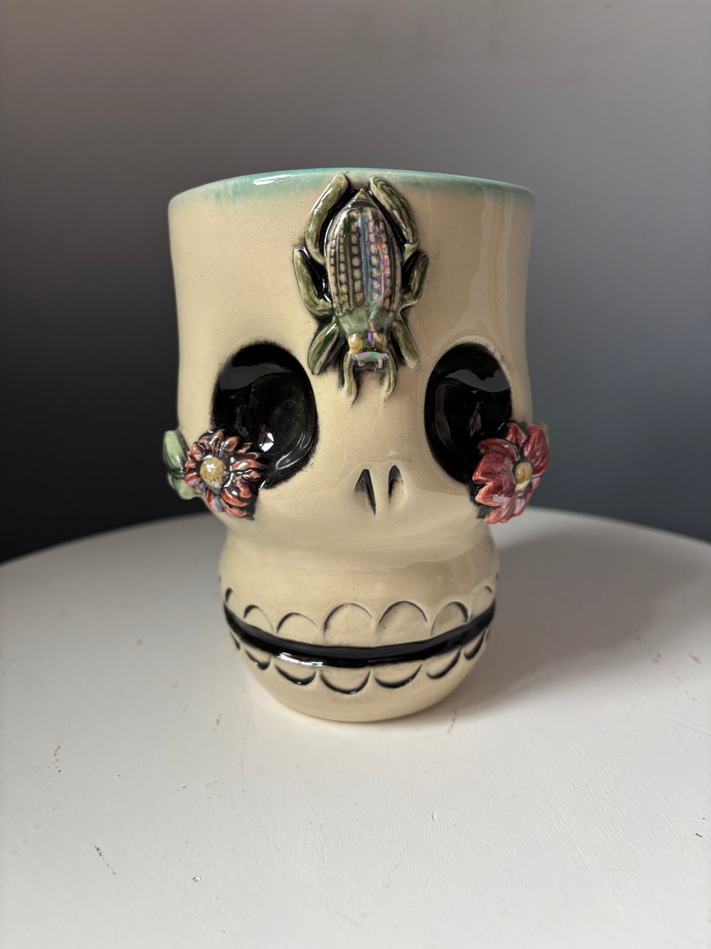 12. Skully Beetle and Flowers Tumbler