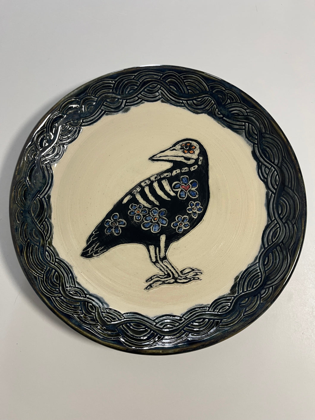 46. Crow DOTD plate with black lip and wavy pattern